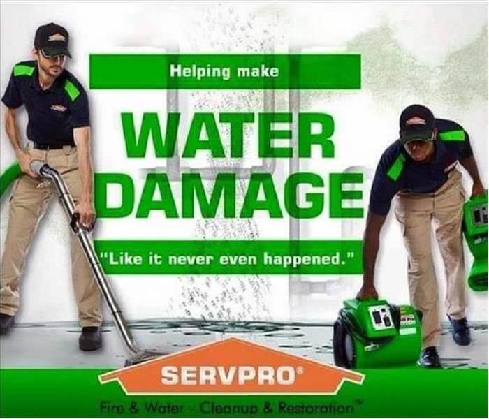 Two SERVPRO employees cleaning up a water damage